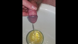 Desperate piss in a glass then pour it over my cock
