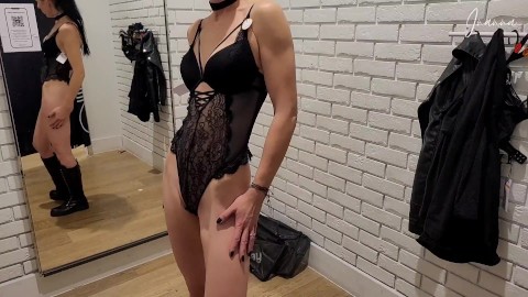 Slim MILF tries on lingerie in the fitting room at the store