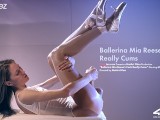 Stunning ballerina jerks off her strapless cock until it cums