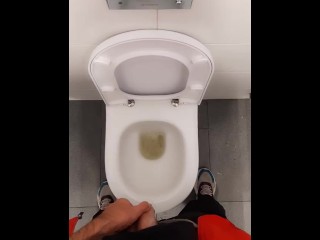 Guy Pissing in the Airport Toilet and Jerking off