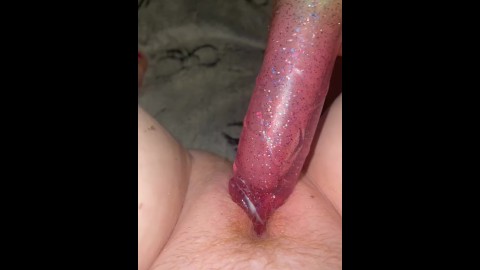 Glowing dildo in creamy pussy