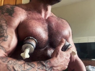 Muscle Daddy uses his Nipple Suckers and Dick Pump.