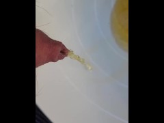 Close up piss in a bucket on a balcony