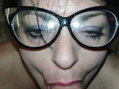 Sexy stepmom with long hair sucks a big cock and smokes a cigarette on her knees