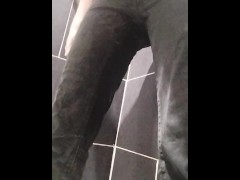 Slowly wetting black jeans