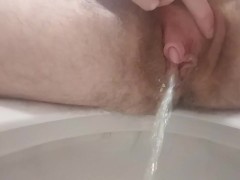 Peeing in the toilet sitting backwards