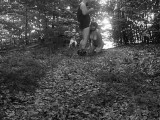 Naked submissive slut taken for a walk on a leash in forest