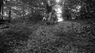 Naked submissive slut taken for a walk on a leash in forest