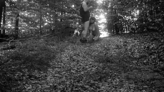 Naked submissive slut taken for a walk on a leash in forest