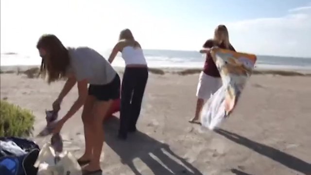 Topless teens get wet in the back of a car