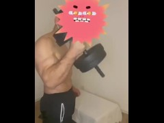 half naked man trains his arms