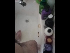 Peeing into the bathtub with water in it