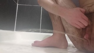 Pissing hard across the shower