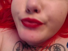 Lady with red hair vaping and teasing boobs naked