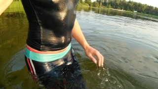 Swimming in the lake in sportswear at sunset...Wet leggings and a T-shirt...