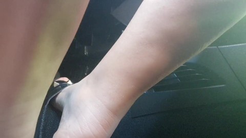 Driving with sexy black slippers in the city beautiful Italian feet