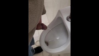 Pissing in toilet at work office