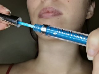 The Blue Gloss Glides over my Lips to Shine