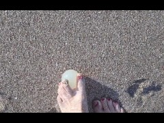 Rubbing a beach egg with my little feet