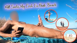 Une MILF suce ma bite sur une plage de nudistes