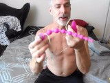Kinky daddy Richard Lennox uses anal beads on his tight ass