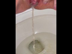 Shaved dirty pussy has longest continuous piss in toilet