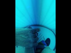 Jerking off in the tanning booth. Hard cock