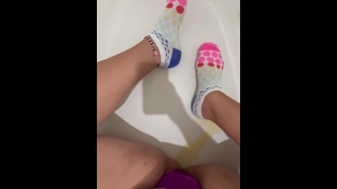 Wife pissing on her socks playing in pee