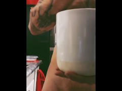 Nerdy uncut guy makes coffee naked