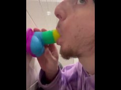 Sucking dildo in gas station bathroom