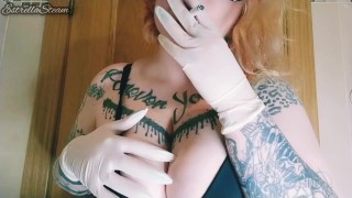 Girl smokes a cigarette and plays with her tits with gloves