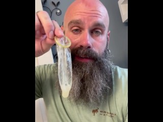 Eating a Load out of a Condom after being Fucked at Gloryhole