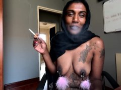 Desi in hijab smoking while wearing nipple clamps