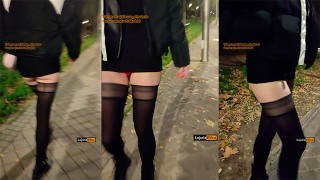 長い脚を持つ女の子は、公共の場で通りをセクシーに歩いています。ストッキングの売春婦妻露出症の人