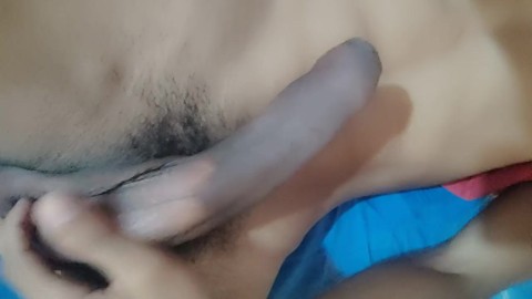 Hot young man masturbates in bed