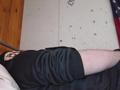 Trans man in skull mask and gear uses a toy