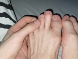 Skinny cute feet fingers stretched out bitten nails