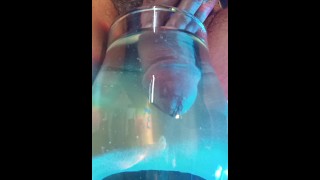 Urine and cum show inside a glass glass with waterUrine and cum show inside a glass glass with water