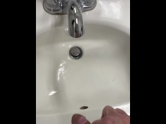 Taking a naughty piss in a public restroom sink hope I get caught