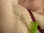 Preview 4 of Redhead with a huge bush and hairy pits combs her body hair and spreads her big gaping pussy.