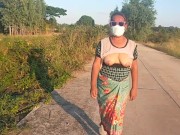 Preview 6 of Auntie walks and shows off her breasts on the side of the road.