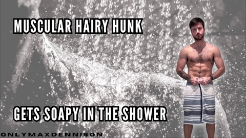 Muscular hairy hunk getting soapy in the shower