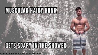 Muscular hairy hunk getting soapy in the shower