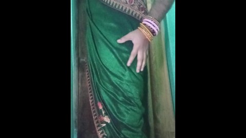 Indian gay Crossdresser Gaurisissy in Green Saree pressing her big Boobs and fingering in her ass