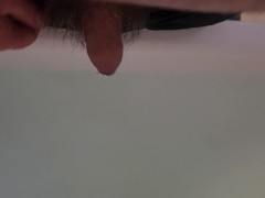 Pissing into a full bath tub
