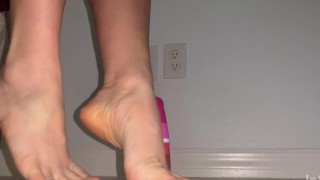 Lubed soles playing with dildo