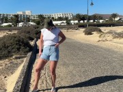 Preview 1 of girl pisses in jeans shorts at the street in public