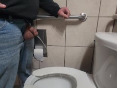 Pissing with huge balls hanging