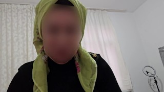 Mature Woman Wearing A Headscarf Demonstrating How To Blowjob