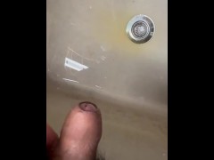 Soft Asian penis peeing in sink